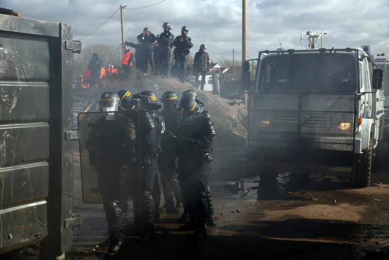 French police taking position at the Calais camp (AP Photo/Jerome Delay)